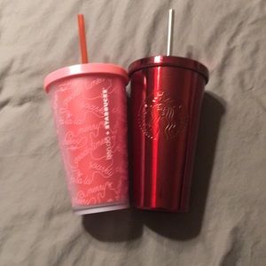 Red and pink Starbucks cups, grande size.